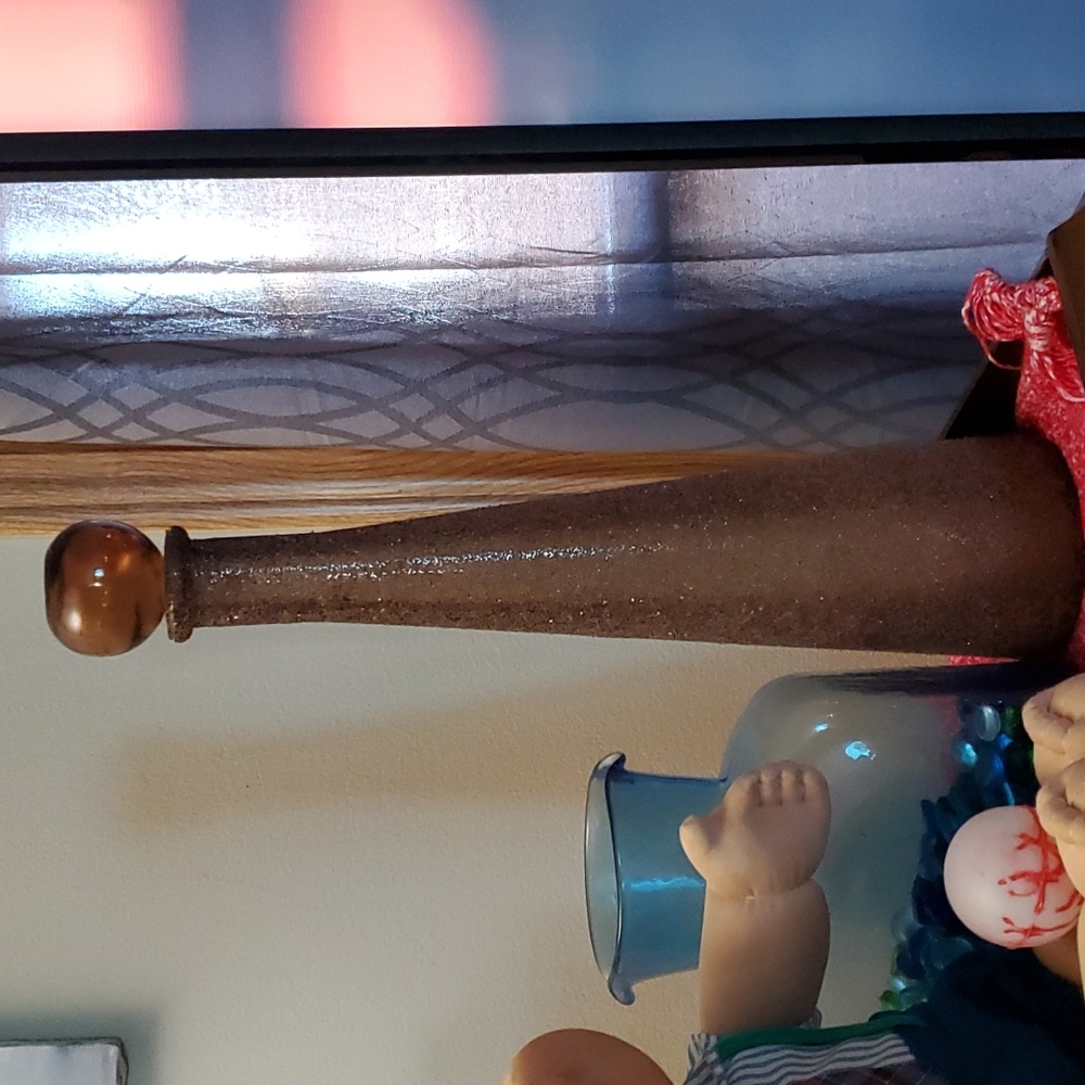 Tall gold bottle with stopper